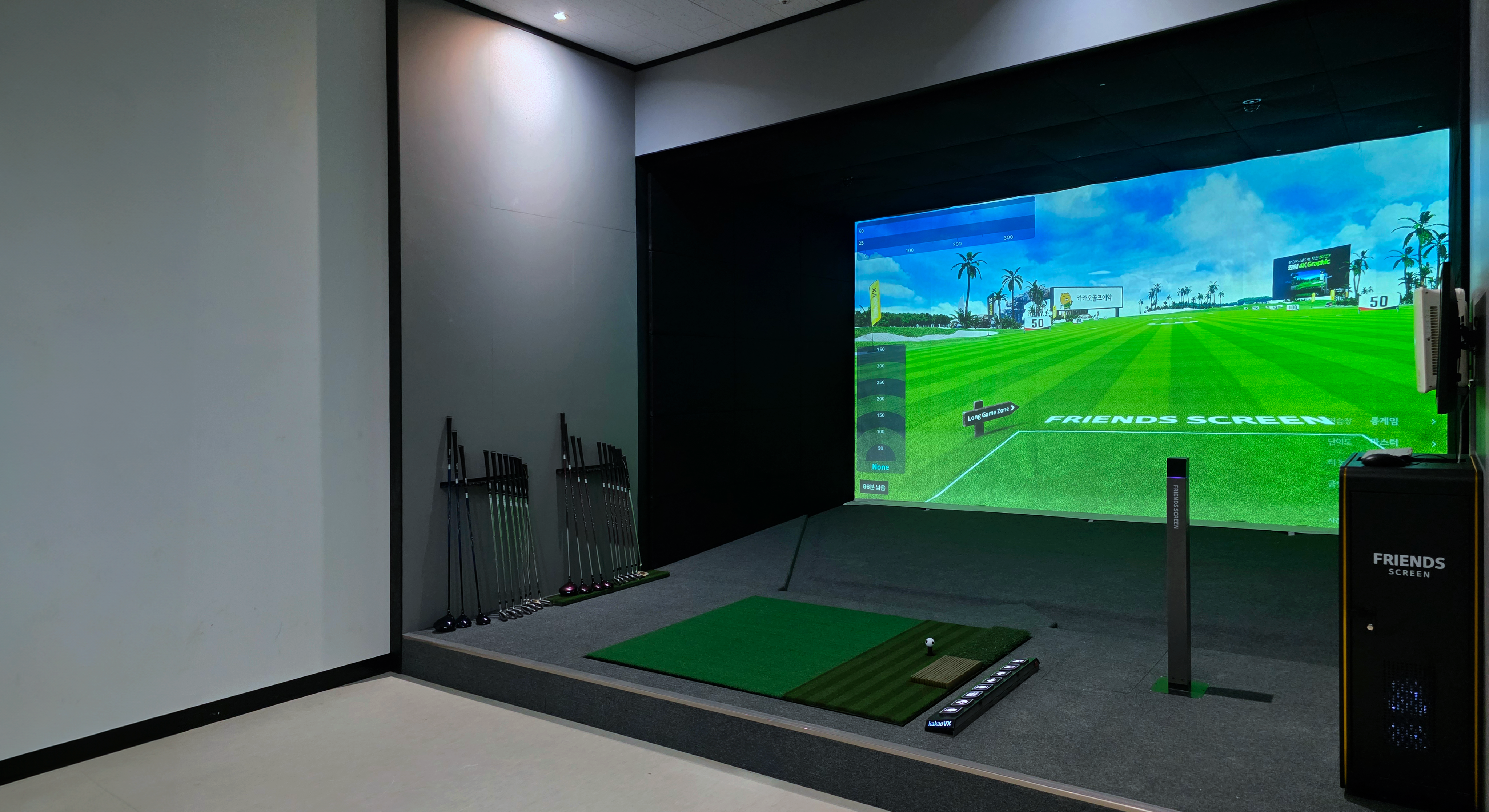 Two women sitting at a modern table talking with a city view behind them.